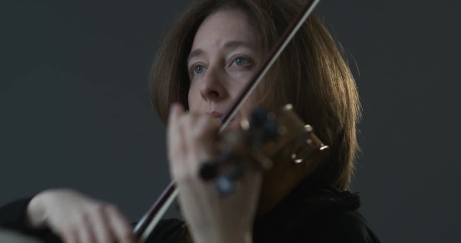 A woman plays the violin