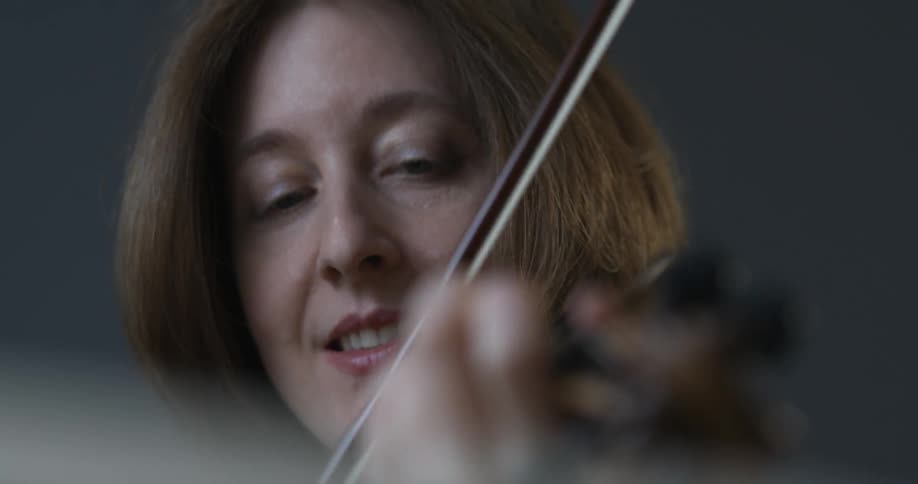 A woman plays the violin