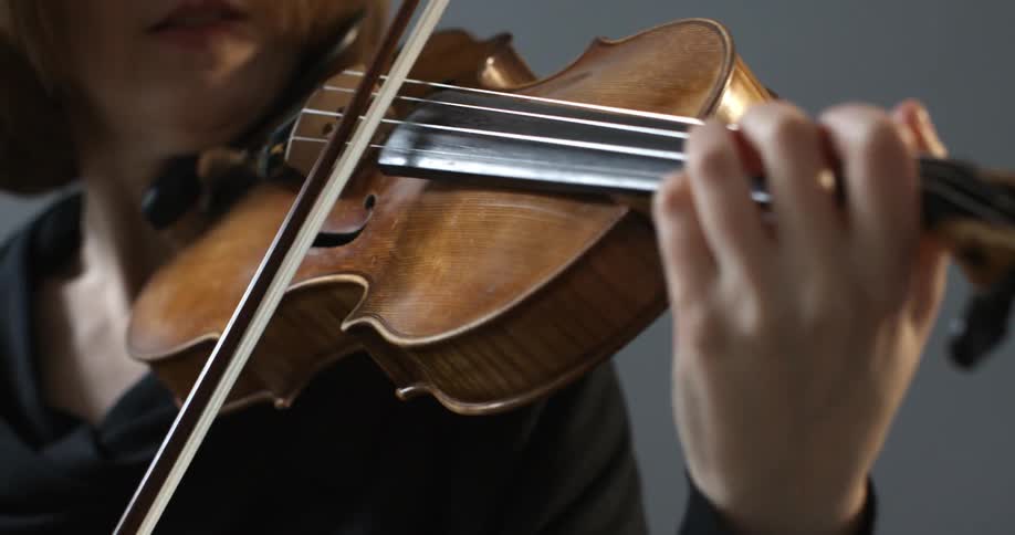 A woman plays the violin