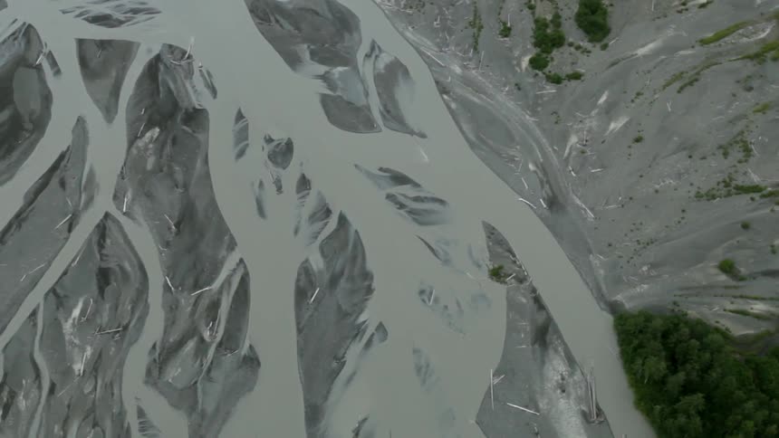 Water cuts through dirt in tiny rivers