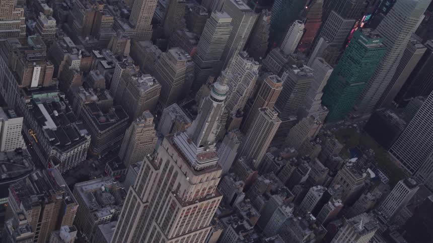 A skyscrapers surrounded by streets and buildings