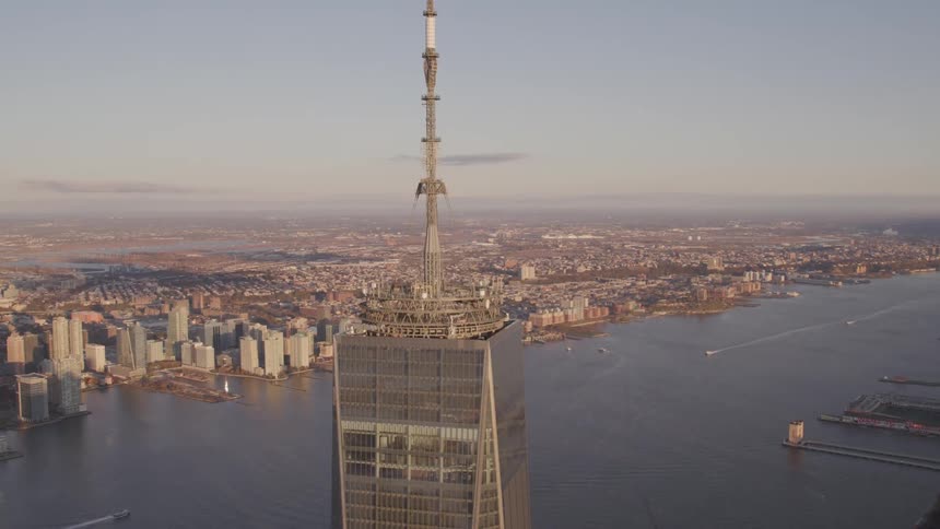 Aerial view of antenna array on top of skyscraper at sunset