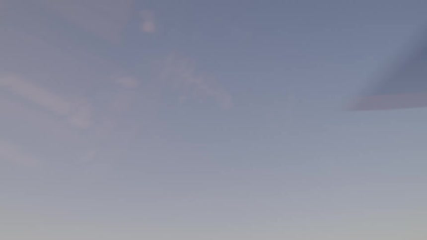 Helicopter blades spin from up high in the sky