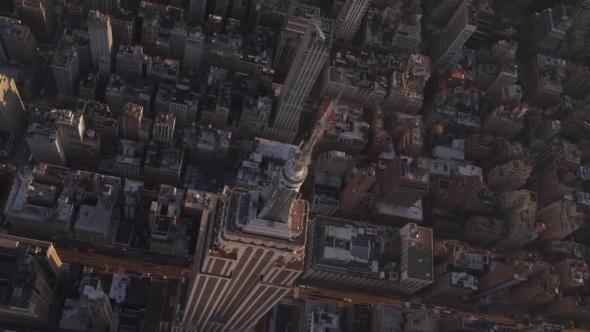 A skyscraper surrounded by buildings and streets