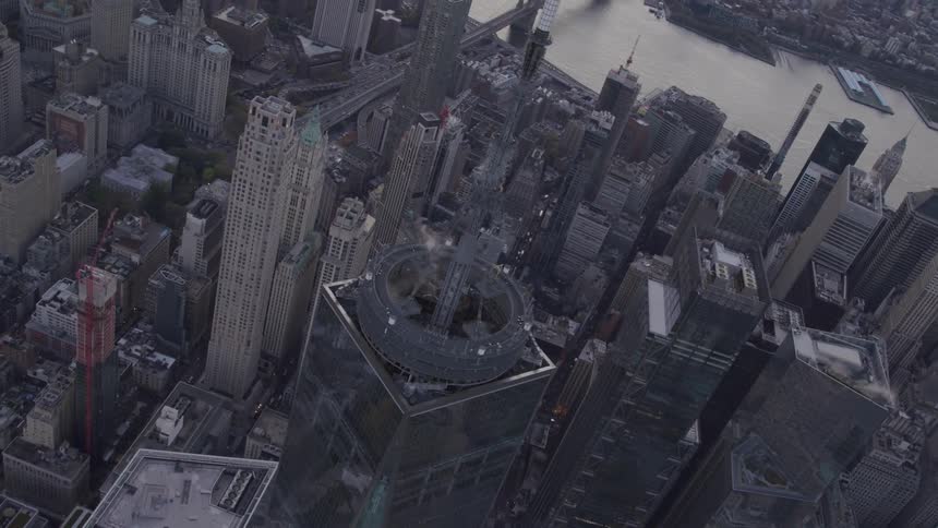 A large antenna atop a skyscraper in a metropolis