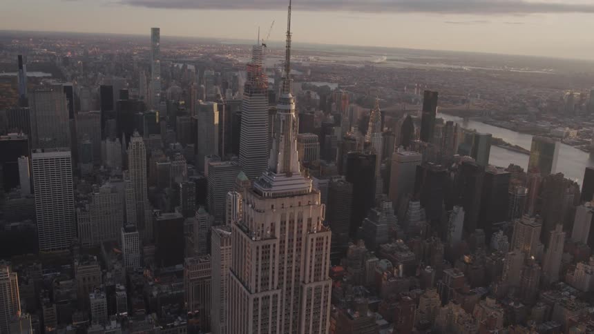The tall buildings fill the large city below