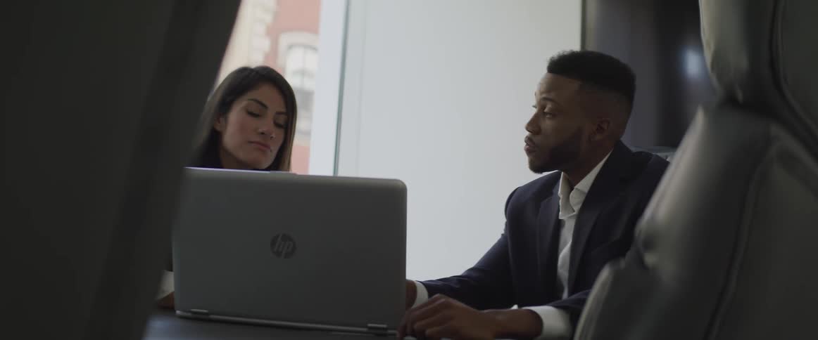 Businessman and businesswoman hold a meeting in the office
