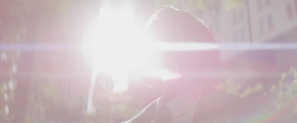 Side view of a businessman standing in the city