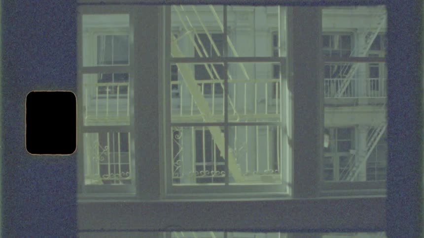 Large windows show staircases in a building