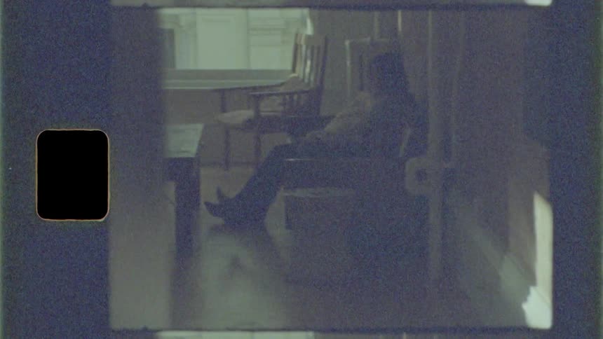 Couple sits on the sofa and talks to each other in the living room