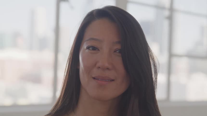 Oriental woman looks towards the camera