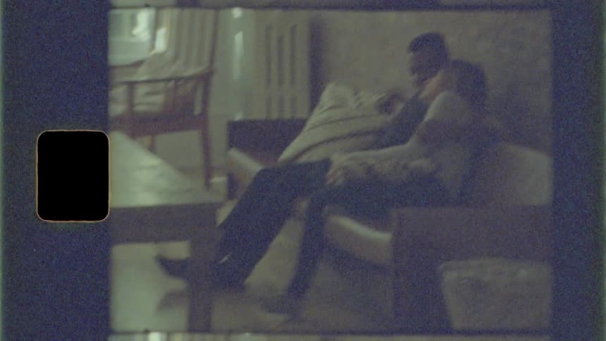 Time lapse of a girl and boy cuddling on the couch