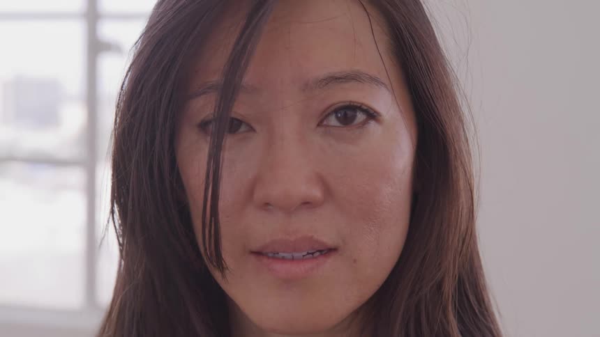 Close up of womans face looking at the camera