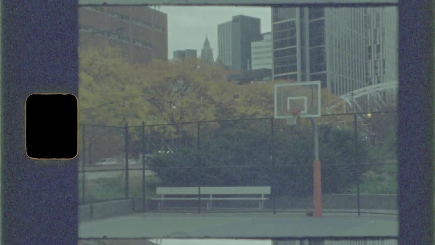 Basketball hoop sits on the court in a city park