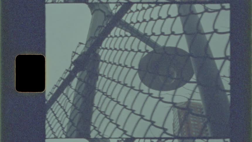 Chain link fence sits next to a light post