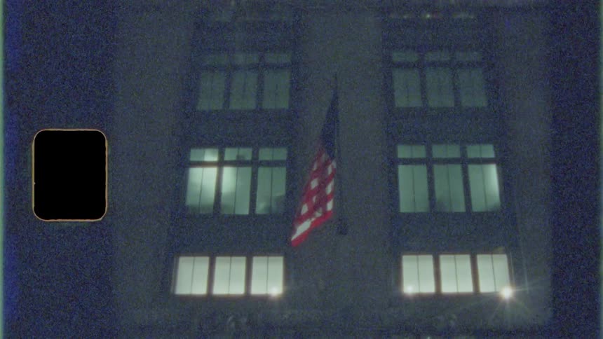 A flag hangs on a building