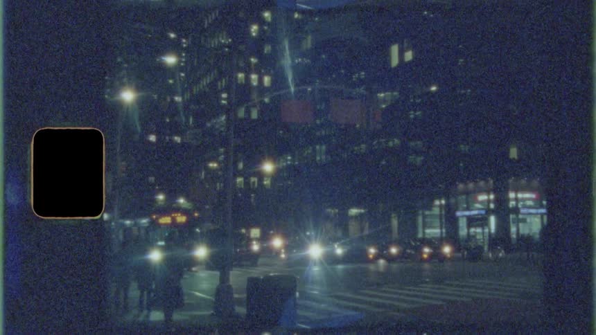A city street with vehicles buildings and a crosswalk