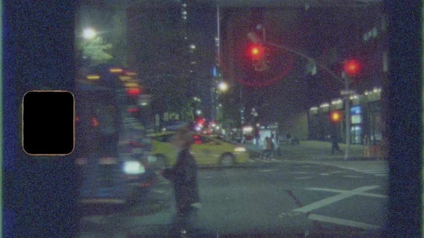 A person walks across a crosswalk and a city bus passes them in a large city