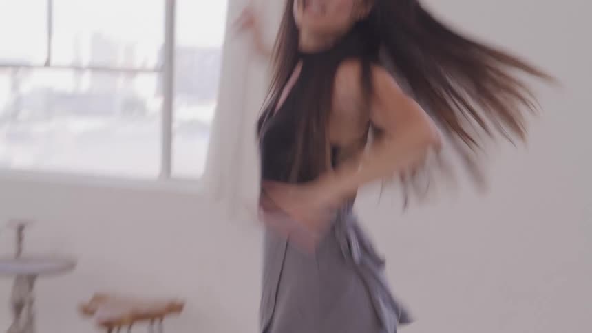 Woman dances in a room
