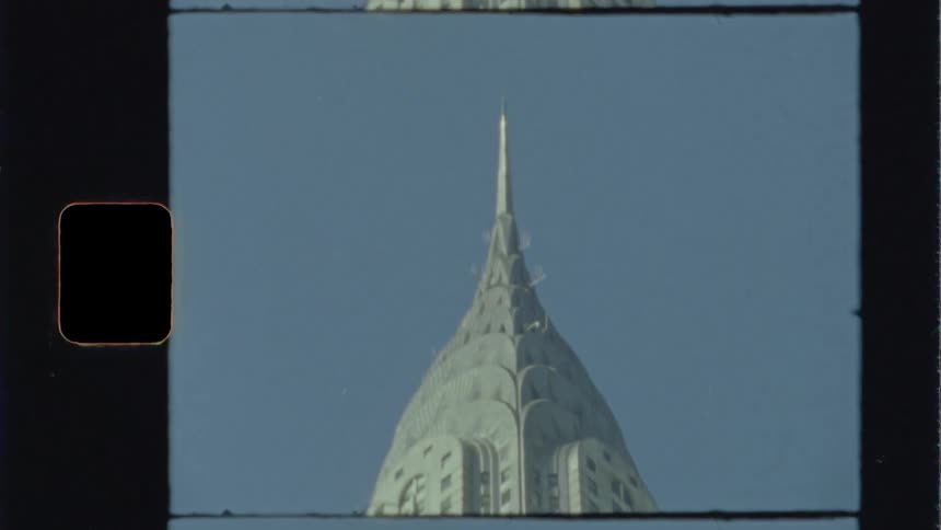 A skyscraper with the sky in the background