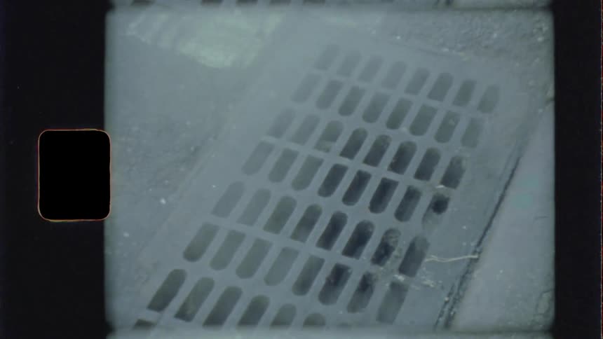 Steam coming out from storm drain from street