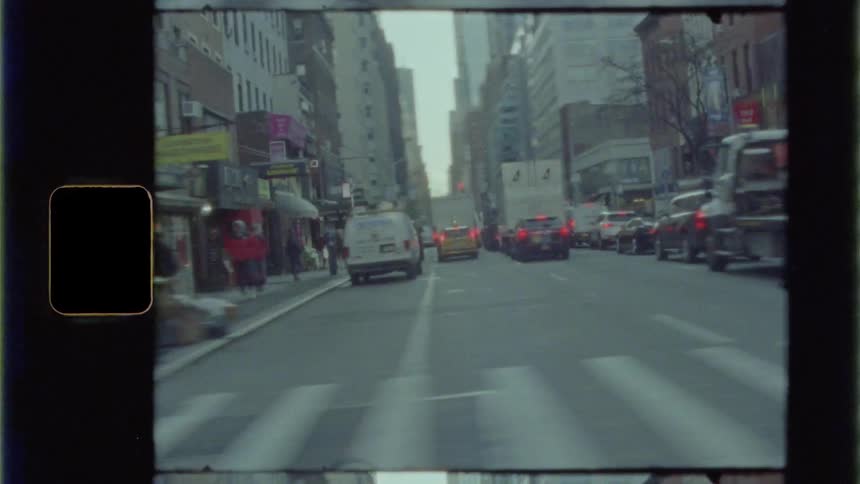 Time lapse of a busy city street with cars and people