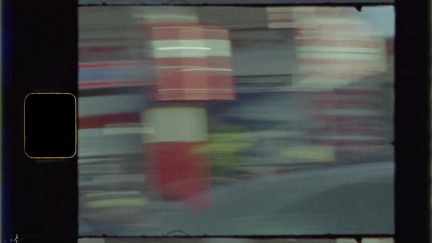 The vehicle is racing by the stores