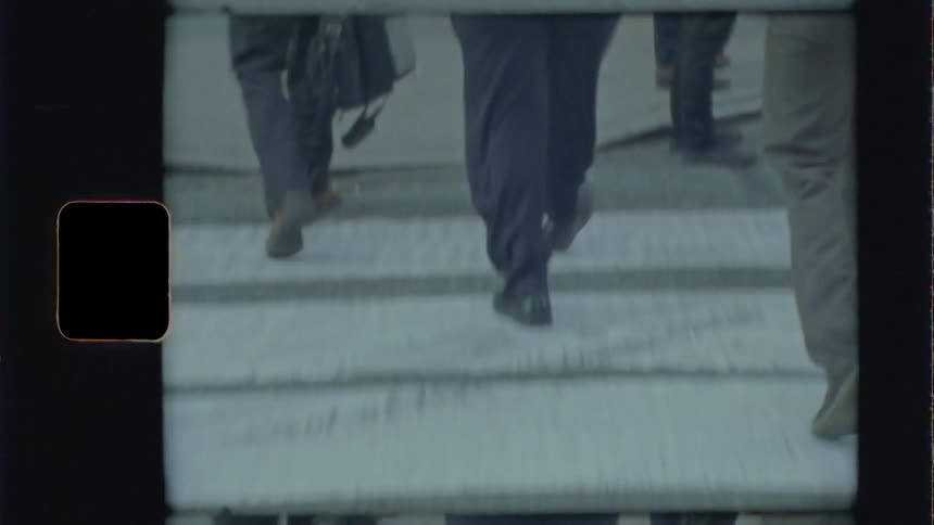 Peoples feet while crossing the street