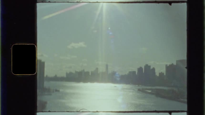 The sun shines over the buildings downtown