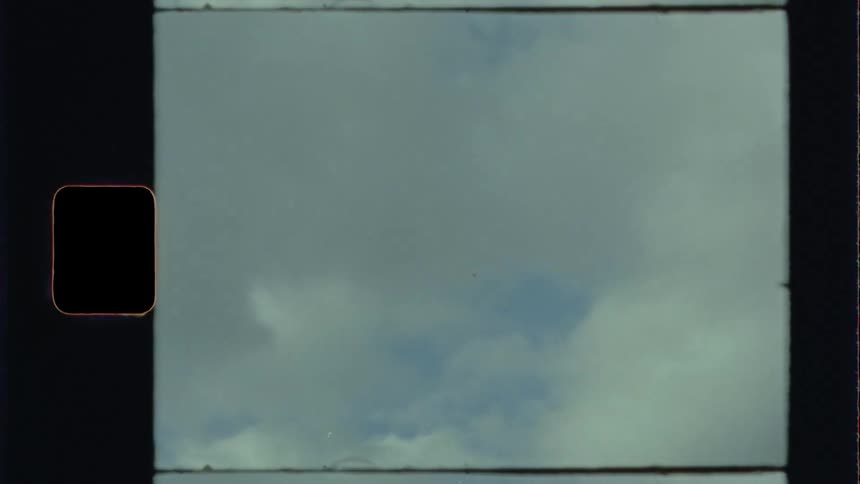 Trees and clouds move past the window