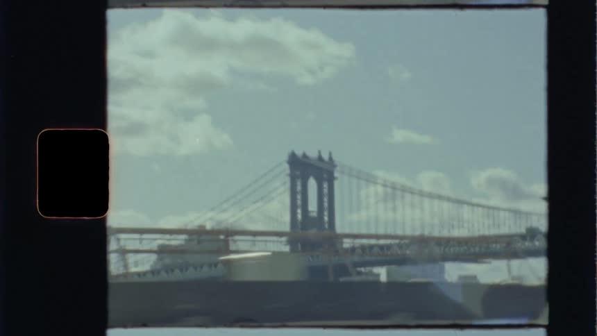 A bridge with buildings and the sky in the background