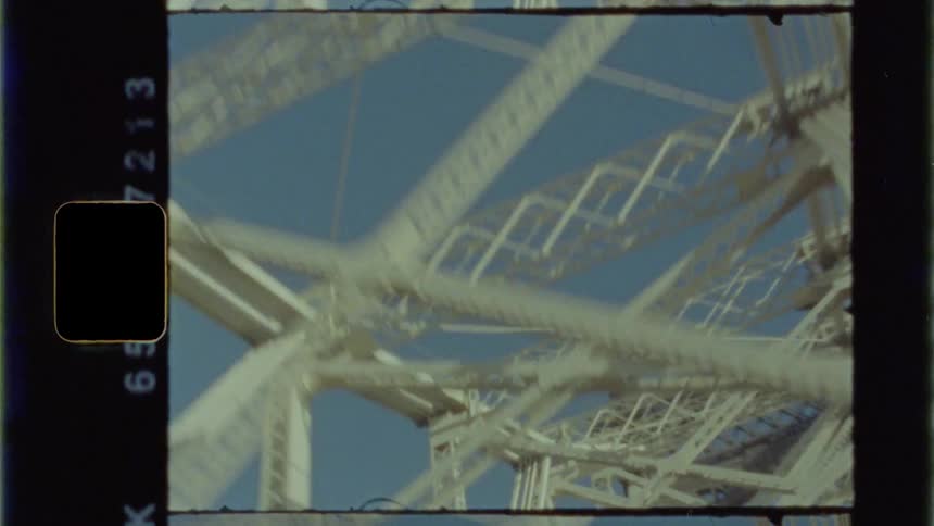 Beams that make up a truss bridge are viewed from below