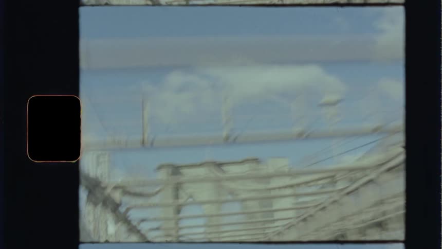 Old footage of driving across an older bridge while traveling