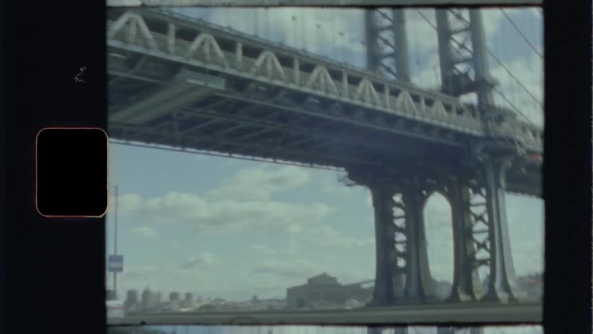 Shot from inside a moving vehicle of driving under a bridge with cars going alongside in the opposite direction