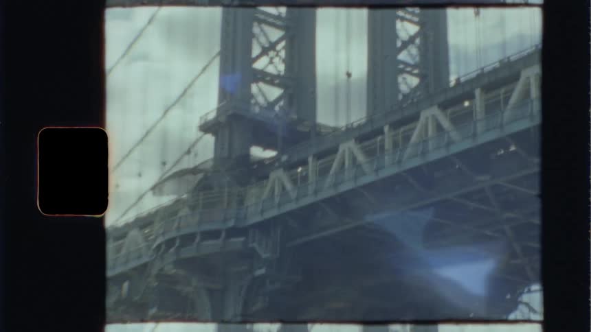 A large bridge seen from below during the day