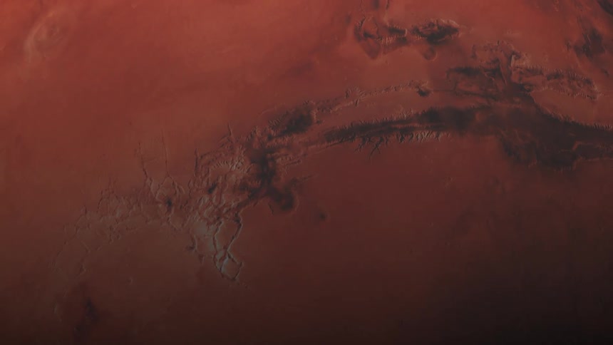 Red black and white colors that looks like a close up of the planet mars