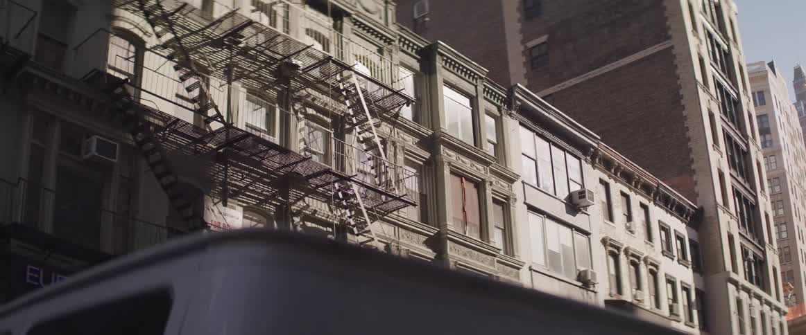 A fire escape of an apartment building in the city
