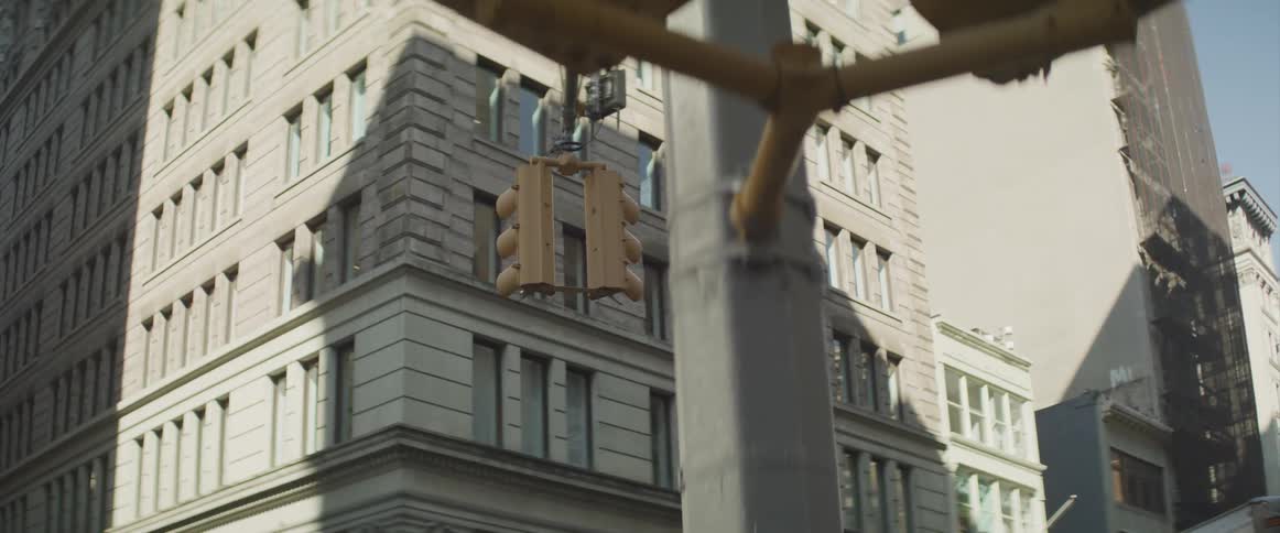 A street light in a city during the day