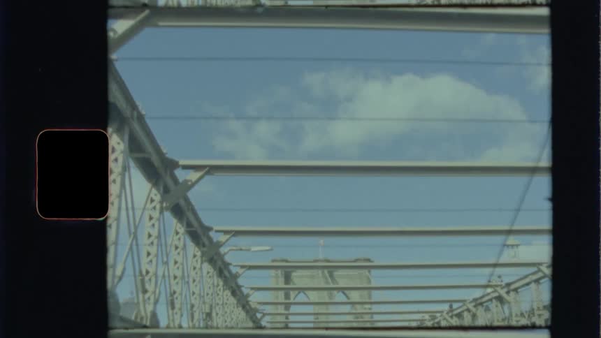 Traveling across a city bridge on a sunny day