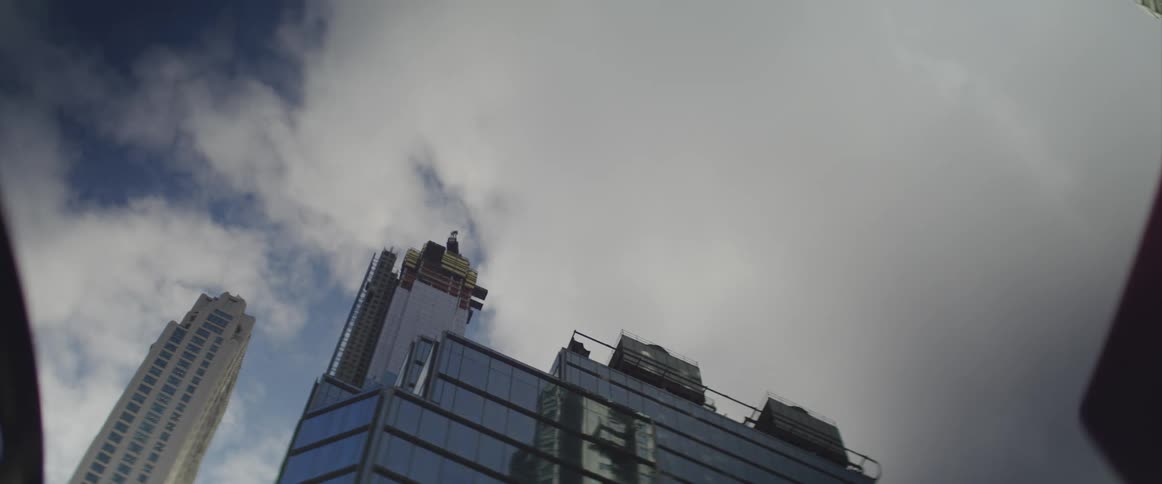 The clouds move quickly over the building