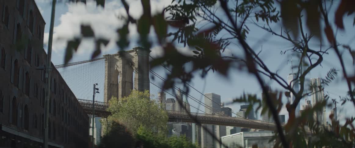 View of brooklyn bridge tower and the high rise buildings in new york city