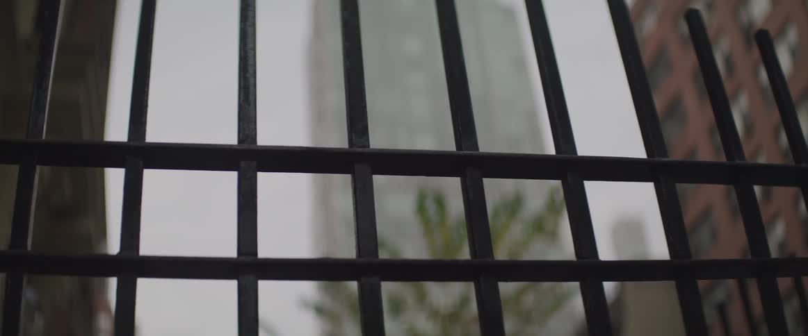 A metal fence in a downtown part of a city
