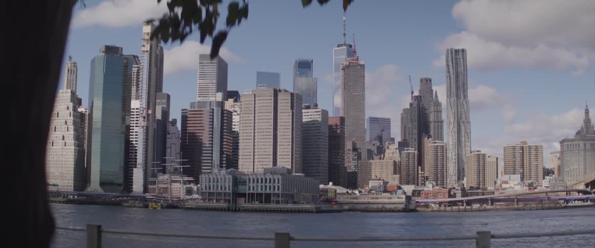 View of high rise buildings and skyscrapers next to the river
