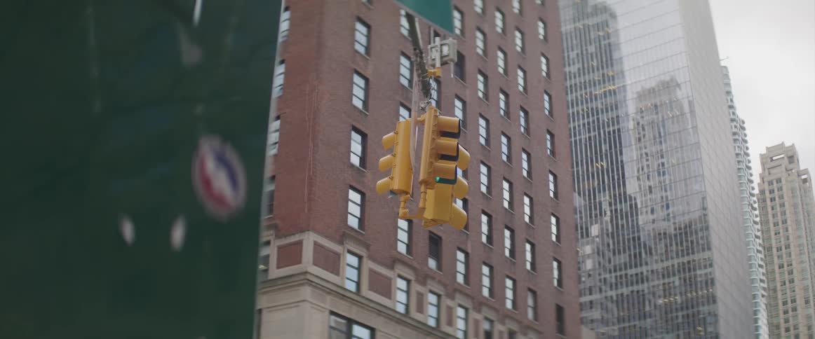 A traffic light in the middle of a downtown area