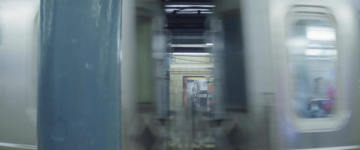 Subway train closing doors and leaving station