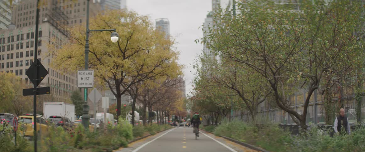 People walk and ride bicycles in the city