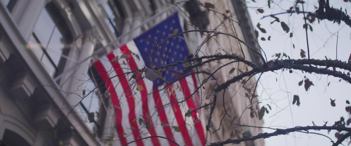 A flag hangs on the outside of a building