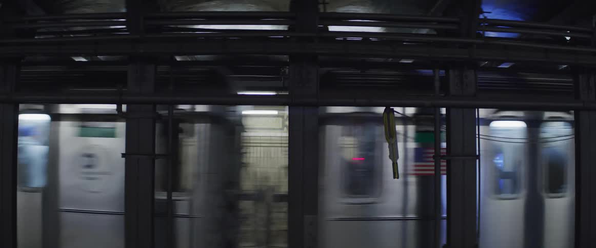 A subway train passing through a station