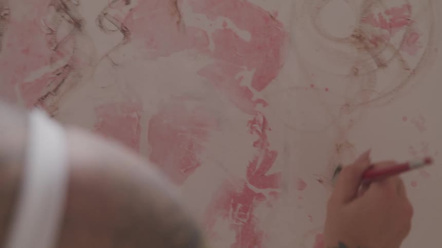 The person paints