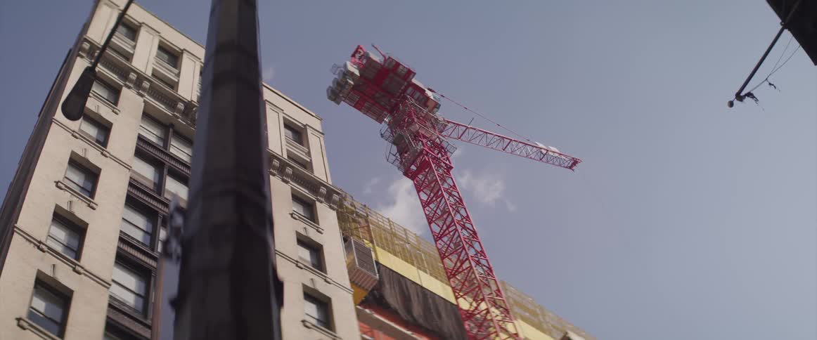 A construction crane next to a building